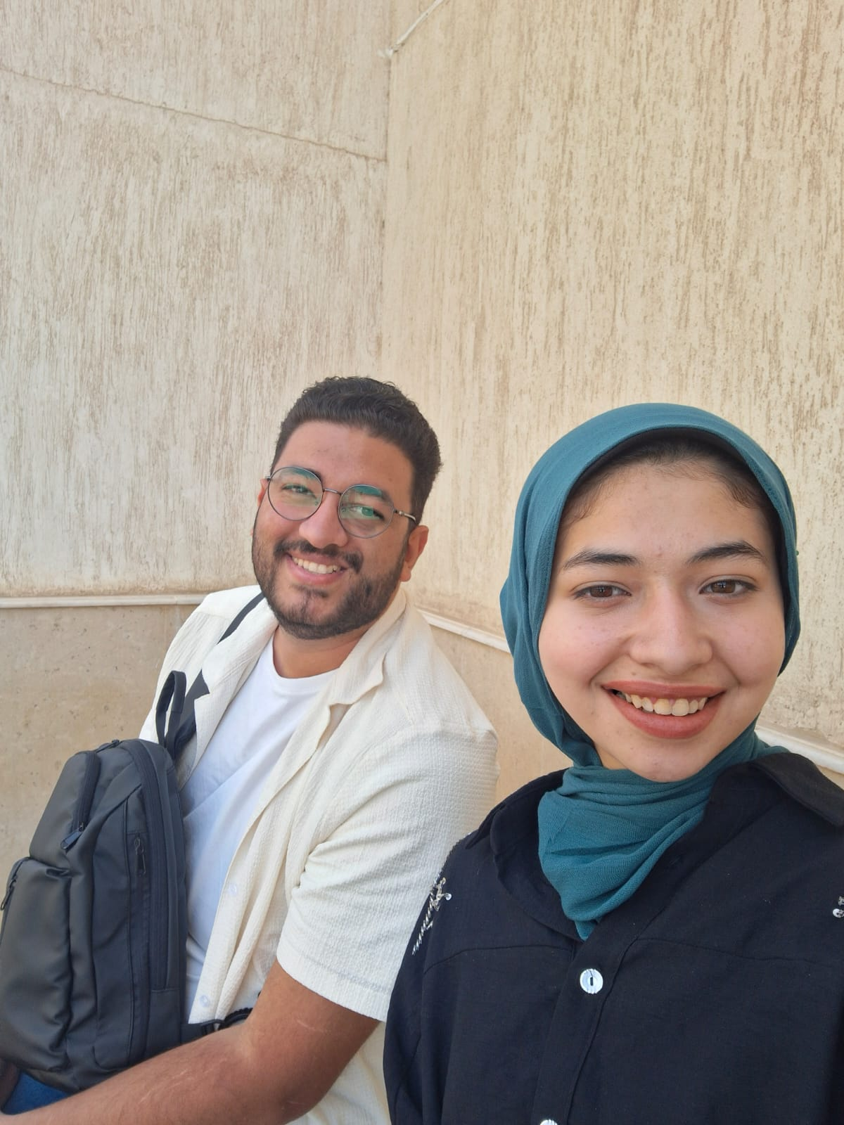 Arwa and me smiling outdoors in a photograph from our time together.